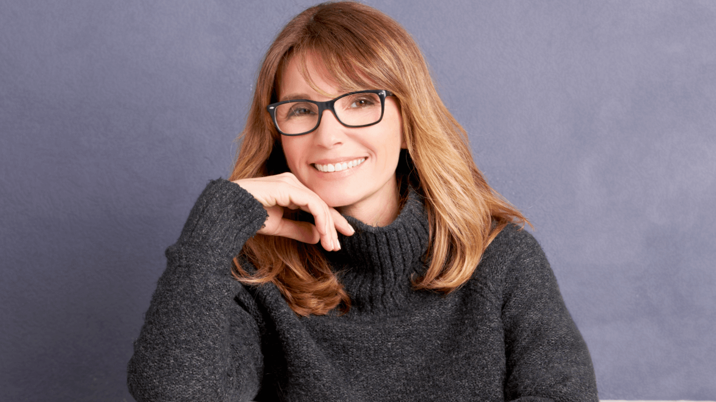 woman in glasses smiling